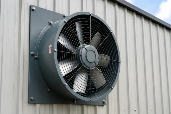 Industrial Axial Flow Fan An industrial axial flow fan mounted on a wall